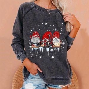 Detail of dark grey Christmas gnome graphic on vintage wash sweatshirt with ribbed cuffs