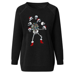 Close-up of festive skeleton print with colorful lights on black crewneck sweatshirt