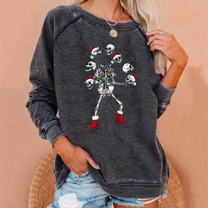 Detailed view of skull Christmas print on vintage dark grey crewneck sweatshirt