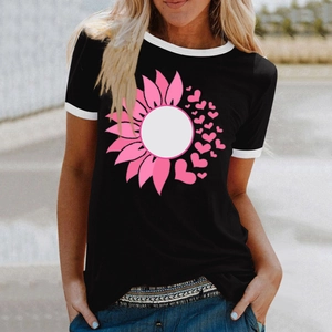 Detail of a black crew neck T-shirt with pink heart sunflower print and white contrast trim