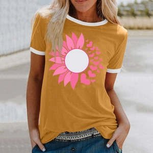 Detail of mustard yellow t-shirt featuring pink sunflower print and white ribbed cuffs