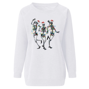 Close-up of skeleton characters with Christmas hats and colorful lights on a white sweatshirt