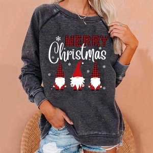 Detail of dark grey Christmas sweatshirt featuring Merry Christmas text and three cute gnomes