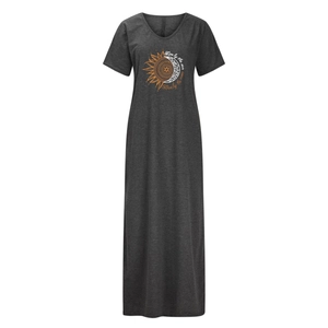 Detail of V-neck maxi dress featuring sun and moon print with Live by the sun text