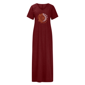 Detail of V-neck short sleeve burgundy dress featuring sun and moon print artwork