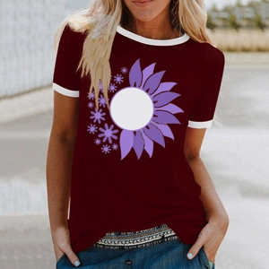 Close-up of wine red t-shirt featuring floral print and white contrast trim on sleeves