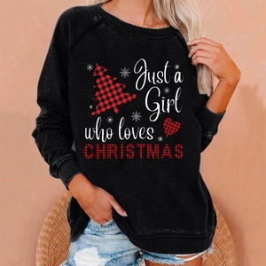Detail of Christmas hoodie featuring 'Just a Girl who loves Christmas' text and plaid trees