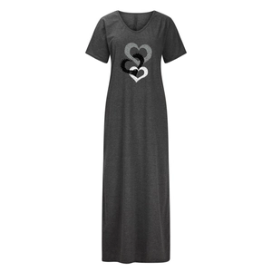 Detail view of the V-neck and triple heart polka dot print on this grey maxi dress