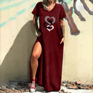 Detail of burgundy V-neck maxi dress featuring heart prints and a side slit design