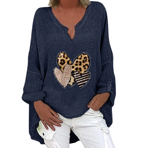 Detail view of v-neck long sleeve blouse featuring leopard and striped heart print pattern