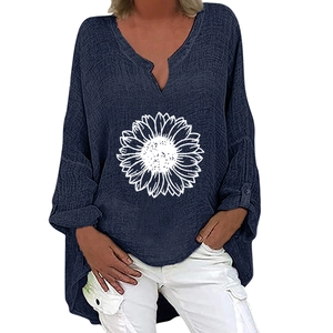Detail of navy cotton linen blouse with V-neckline and white sunflower print patterns