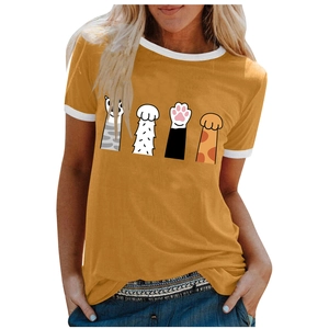 Detail of creative cat paw prints on a yellow short-sleeved t-shirt with white contrast edges