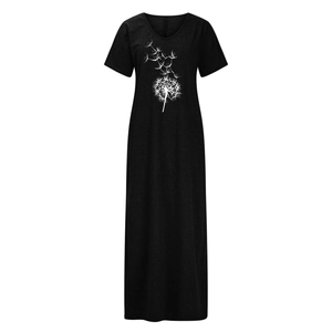 Close-up of white dandelion print and soft knit texture on black V-neck maxi dress