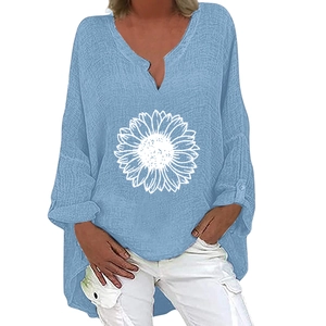 Detail of light blue V-neck linen shirt with a large white sunflower print for women
