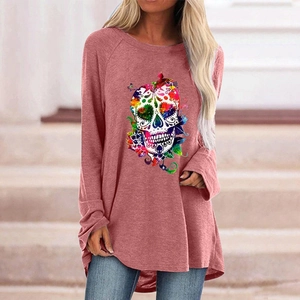 Close-up of colorful sugar skull floral print on long sleeve Halloween gothic top
