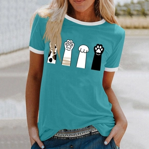 Close-up of contrast ribbed crew neck and cartoon cat paw prints on a blue summer t-shirt