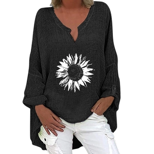 Detail of a black V-neck cotton shirt featuring a white sunflower print and texture