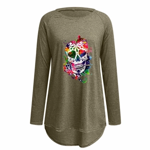 Detail of artistic floral skull print and high-low hem on olive long sleeve top