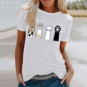 Close-up of a white cotton t-shirt featuring four playful cartoon cat paw prints on the chest