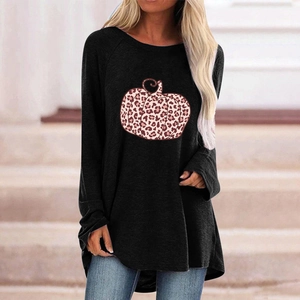 Detail of leopard print pumpkin on a loose black long-sleeve Halloween t-shirt