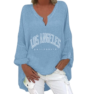 Detail of light blue V-neck top featuring white Los Angeles California printed graphic