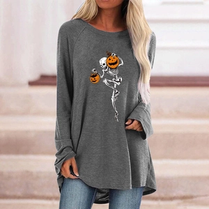 Close-up of dancing skeleton and pumpkin print on a gray gothic long sleeve t-shirt