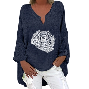 Detail of V-neck cotton linen blouse featuring white rose print and navy blue textured fabric