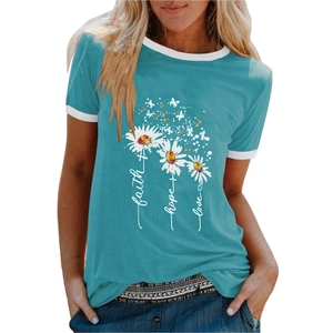 Detail of teal t-shirt featuring daisy butterfly print and white contrast neckline