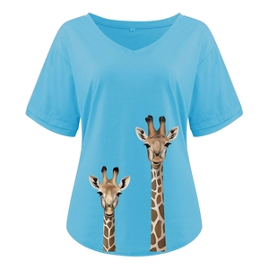 Detail of the V-neckline and giraffe graphic print on a light blue summer T-shirt