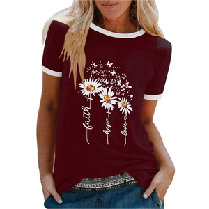 Detail of burgundy T-shirt showing faith hope love text and white daisy flower print
