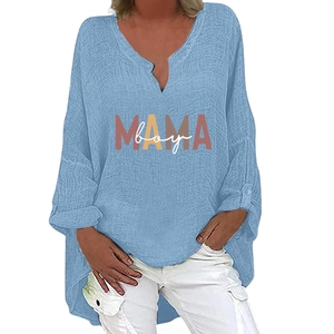 Detail of light blue cotton linen shirt with V-neck and MAMA boy graphic print