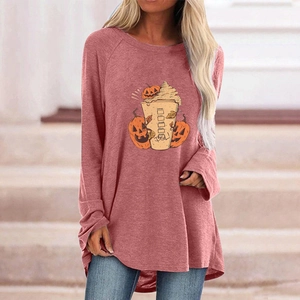 Detail of loose-fit dusty pink tunic with Halloween pumpkins and PSL coffee cup print