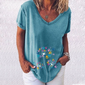 Close-up of V-neck T-shirt with artistic dandelion and colorful paw print pattern