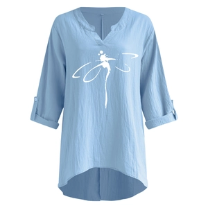 Detail of light blue linen shirt featuring V-neckline and white dragonfly print design