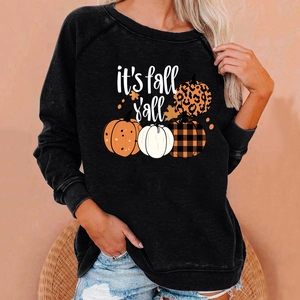 Detail of raglan sleeves and festive pumpkins with it's fall y'all text on black sweatshirt