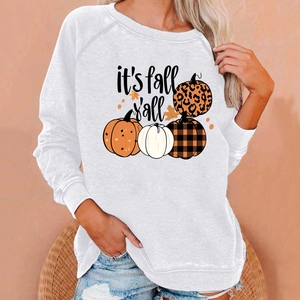 Detail showing autumn pumpkin print and It's Fall Y'all text on white crewneck sweatshirt
