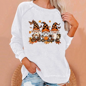 Detail of white raglan sweatshirt with autumn gnome print and falling maple leaves