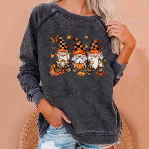 Detail of grey raglan sleeve sweatshirt featuring festive autumn gnomes and maple leaves