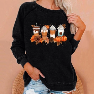 Close-up of raglan sweatshirt featuring autumn coffee cups and pumpkins print