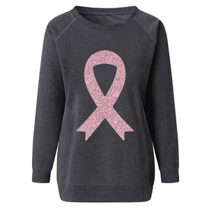 Detailed view of pink glitter ribbon print on gray raglan sleeve sweatshirt fabric