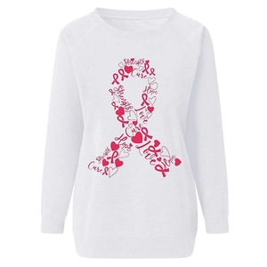 Detailed view of pink ribbon print with hope and strength text on white sweatshirt