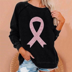 Detail of a black long-sleeve sweatshirt with a pink glitter breast cancer ribbon print