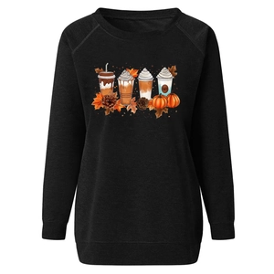 Detail of high-quality autumn latte and pumpkin print on black crewneck sweatshirt