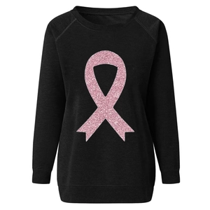 Close-up of pink glitter breast cancer ribbon on high-quality black fleece sweatshirt