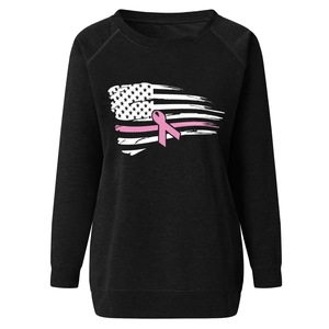 Detail of pink breast cancer awareness ribbon and US flag print on black sweatshirt