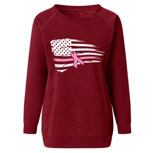 Detail of burgundy sweatshirt featuring a breast cancer awareness ribbon and US flag print