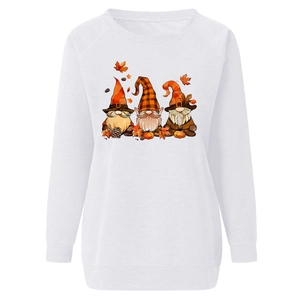 Close-up of autumn gnomes and pumpkin print on white long sleeve sweatshirt