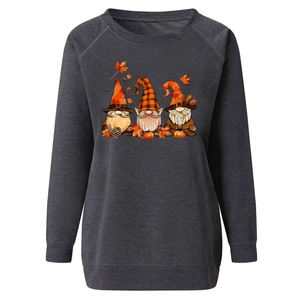 Close-up of autumn gnomes and pumpkin print on gray long sleeve sweatshirt for women