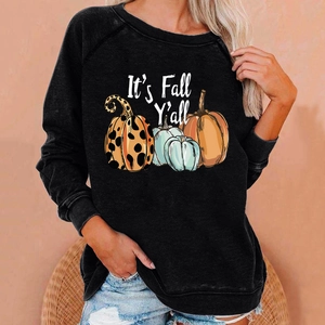 Detail of Halloween pumpkin print and 'It's Fall Y'all' text on black raglan sweatshirt