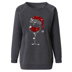 Detailed view of dark grey Christmas sweatshirt with glitter wine glass and Santa hat print
